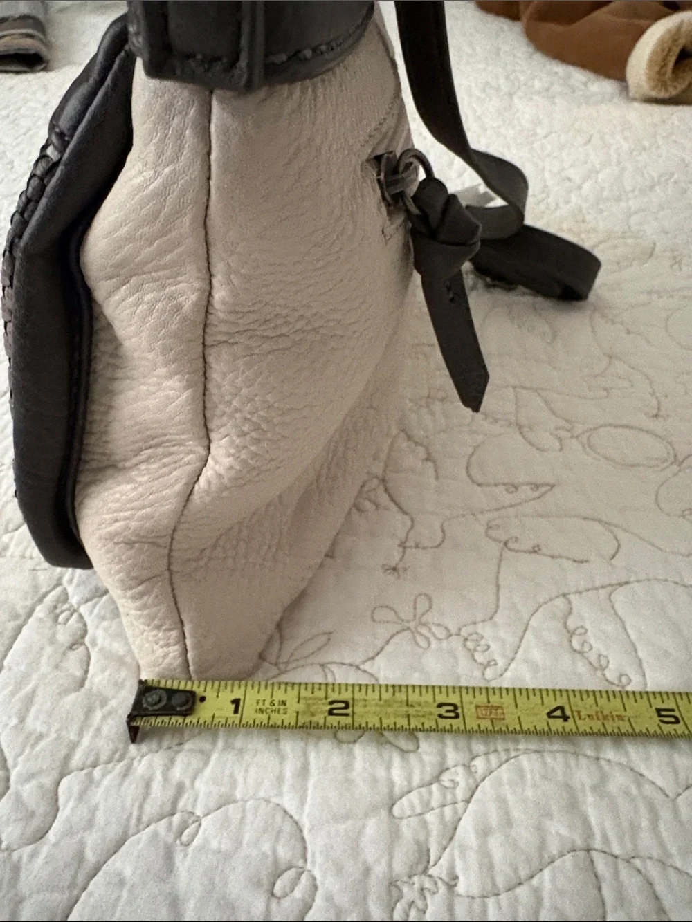 The Sak Leather Messenger Bag in Black and Cream Woven Front